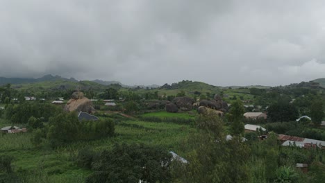 aerial - riyom rock boulder formation, riyom town, plateau state, nigeria, rising