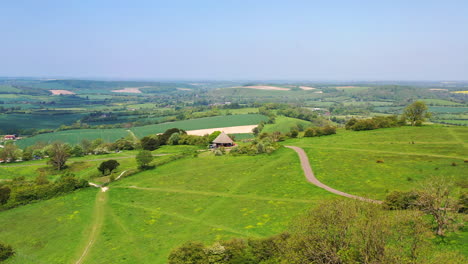 Aerial-flying-towards-Butser-Hill-Sunny-day-UK-4K