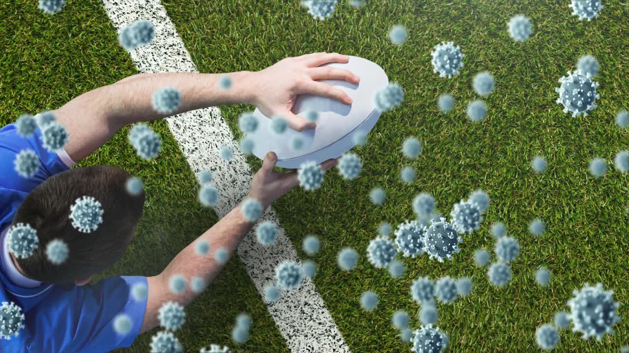 코로나 19 바이러스 세포의 애니메이션 카우카시안 남성 럭비 선수가 공을 들고 있습니다.