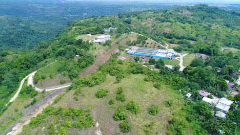 Aerial Dolly Shot Of A Hydro Electric Power Plant On Top Of A Mountain