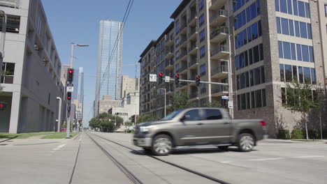 Cars-passing-through-an-intersection-in-downtown-Houston-in-Texas