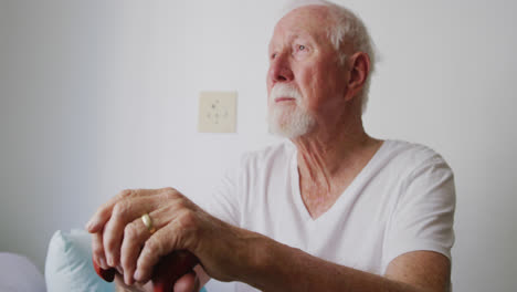 senior man in social distancing in his room of retirement house