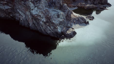 aerial view of a rocky beach and water