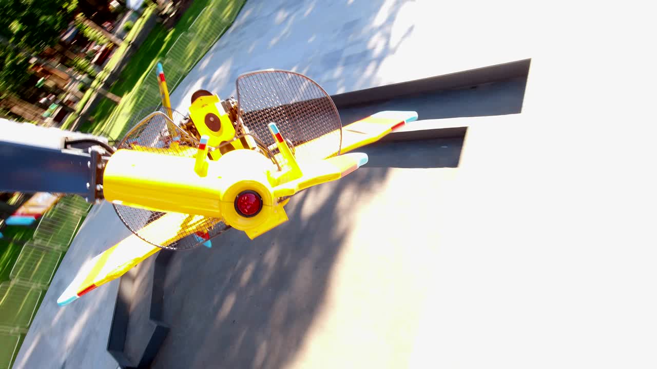 attraction of spinning, flying planes in the amusement park. first person video