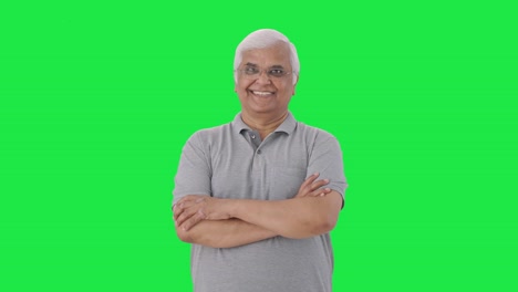 Happy-Indian-old-man-standing-crossed-hands-Green-screen