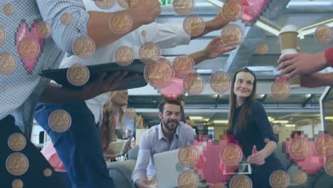 Animation-of-coins-over-diverse-business-people-in-office