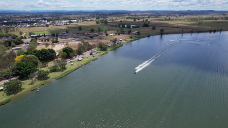 speeding boats on clarence river competing in race event in grafton, nsw, australia