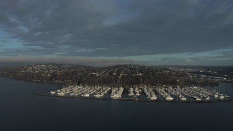 aerial pan over seattle marina sunrise