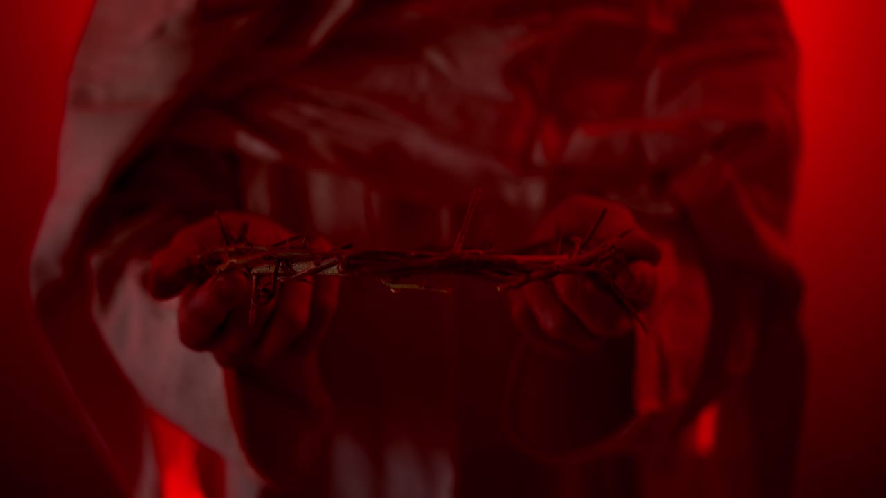 Jesus Christ holding crown of thorns for Christianity, Easter visual, bible scene or temptation, prayer, worship visual.