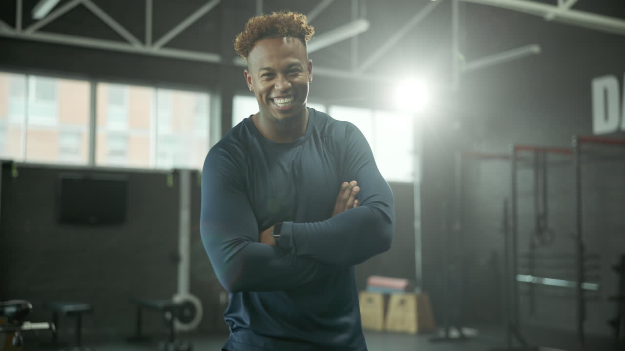 Man in Gym Posing with Arms Crossed