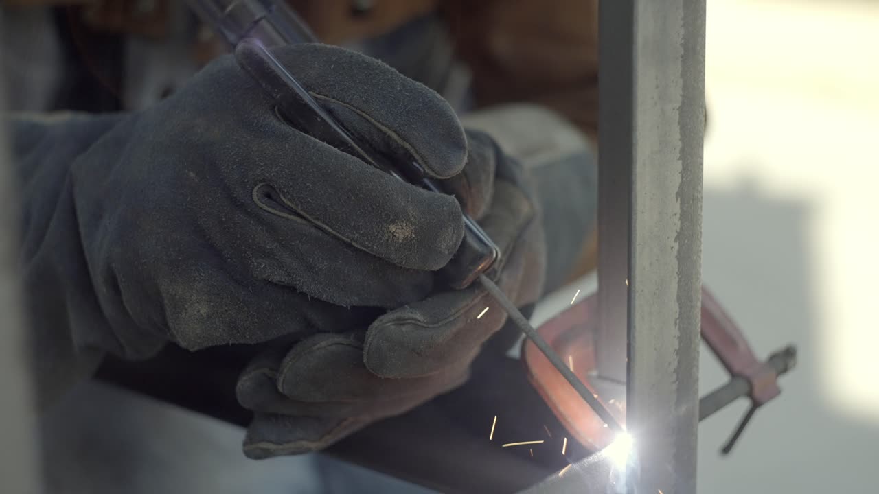 Stick Welding Slow Motion, Close Up Of Gloved Hands Holding Welder
