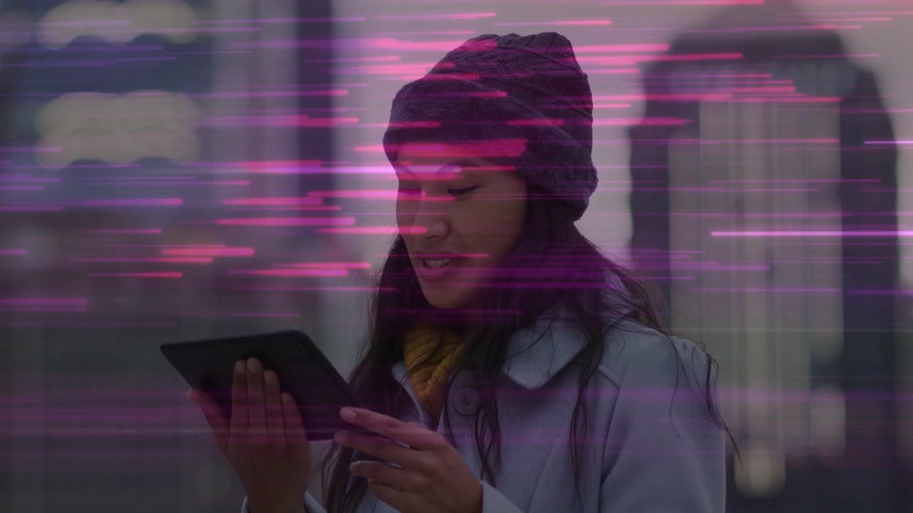 Woman with tablet glancing reacting to text laughing kissing pink-purple streaks sweeping tech