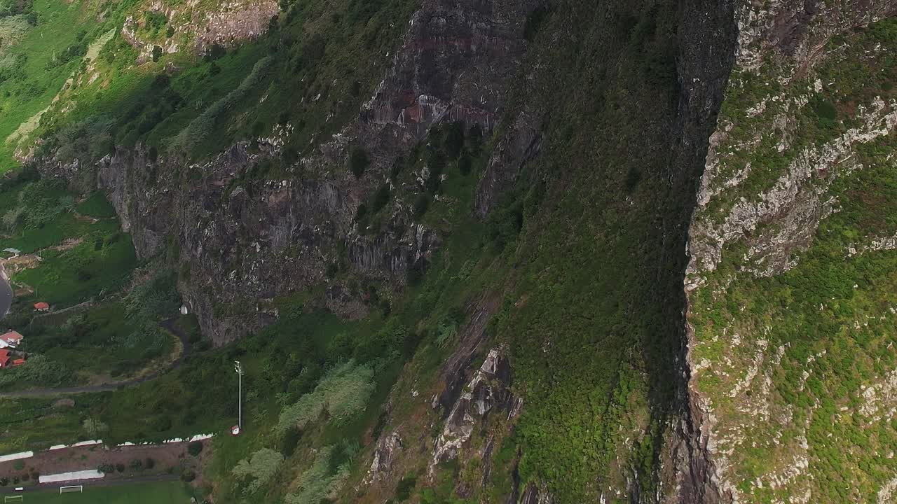Aerial view of Madeira's cliffs and lush landscape from a drone