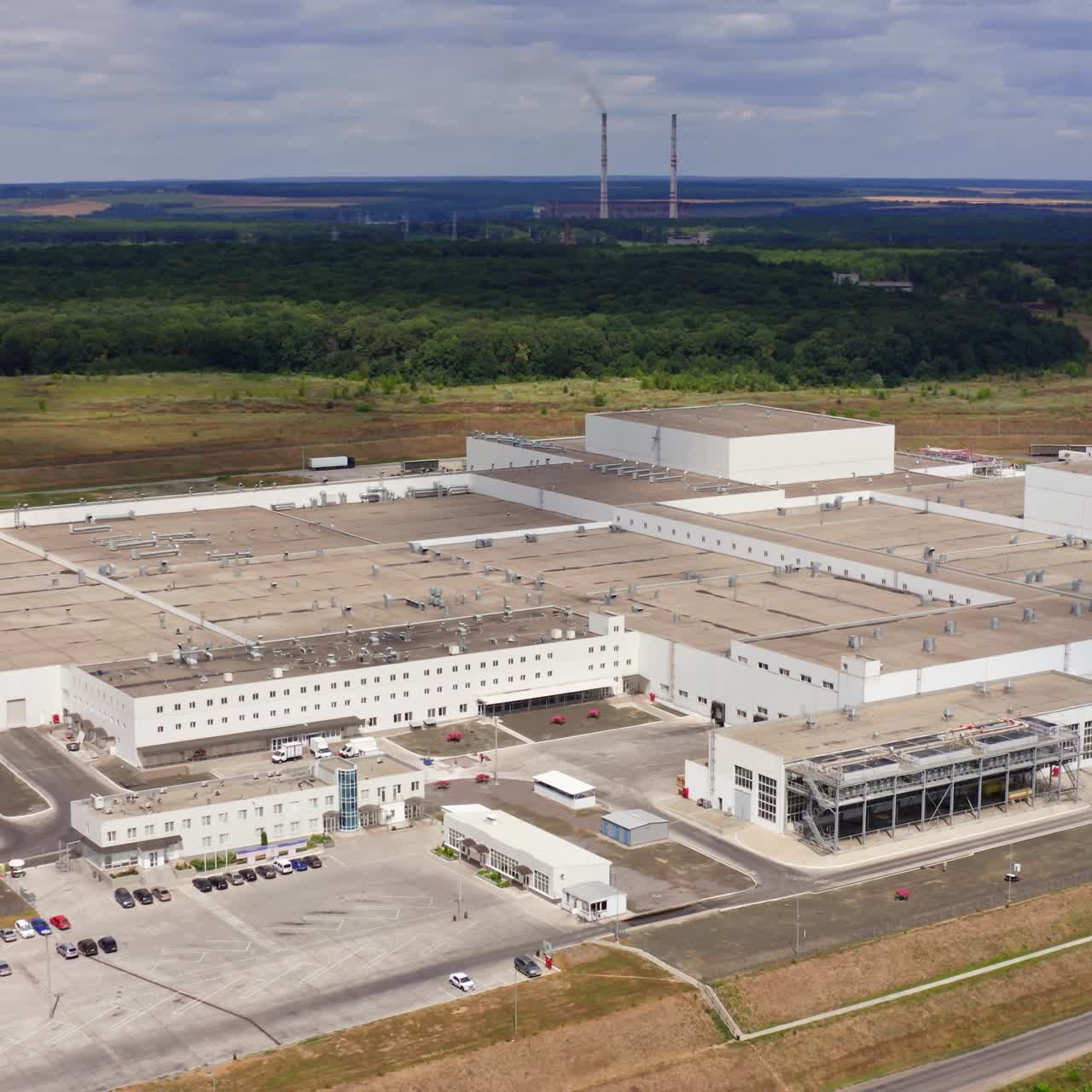 Large modern factory building. Machine building production site. Top view on facility. Aerial view. Open space
