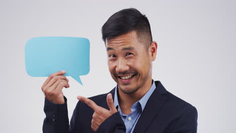 businessman holding speech bubble