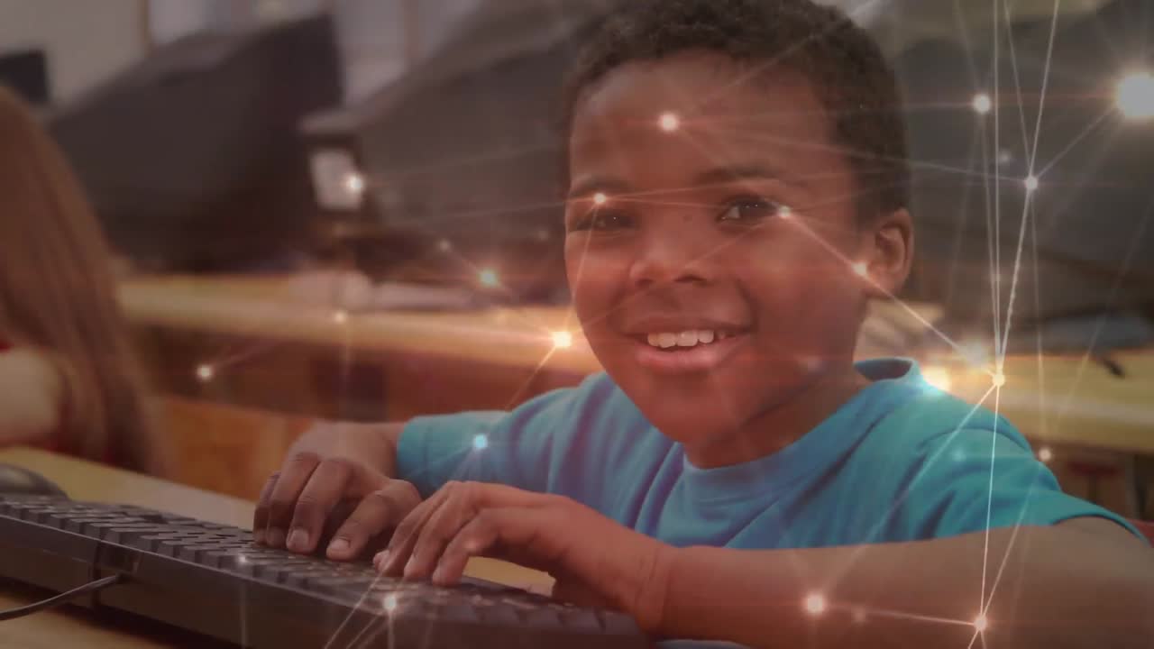 red brillante de conexiones contra el retrato de un niño afroamericano que usa una computadora en la escuela