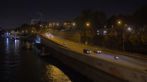 steady shot of a paris road by night