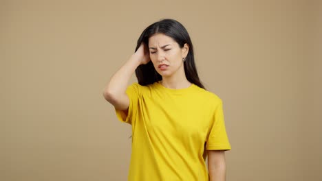 young woman expressing confusion, thought, and slight frustration