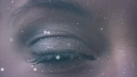 Slow-motion-close-up-shot-of-bokeh-animation-and-woman-closing-eyes