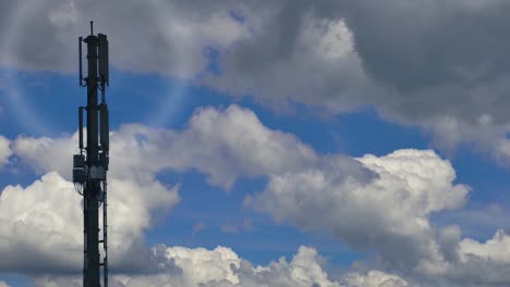 5g animation of telecommunication network tower with signal in front of white clouds and blue sky