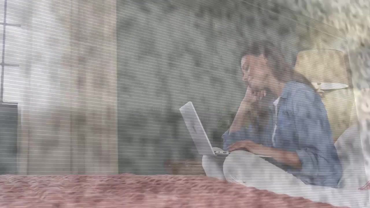 Woman pausing glancing toward window then resuming laptop typing working remotely overlay obscuring