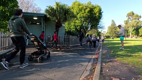 kids walking towards a school building