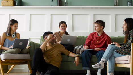 study group sitting on sofa and floor