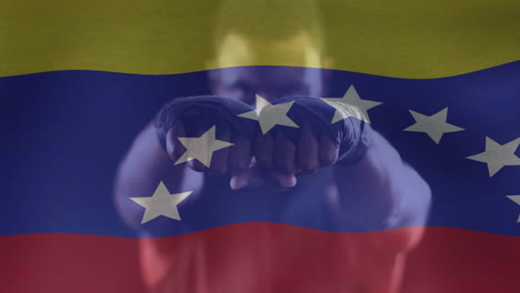 animation of flag of venezuela over caucasian male boxer