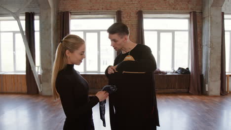 dancers preparing outfits in a spacious studio