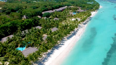 aerial pan along perfect beach resort