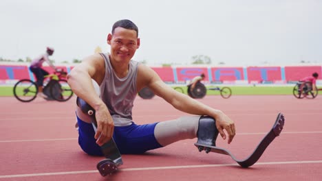 disabled athlete posing on track