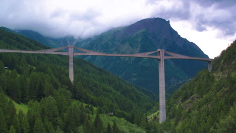 stunning cinematic shot of a concrete bridge in switzerland