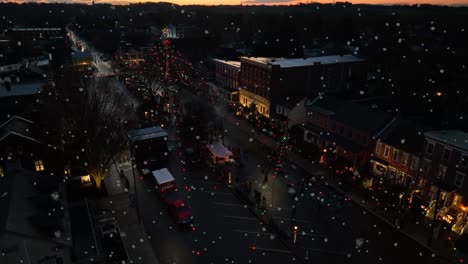 snow in town at christmas. aerial night scene