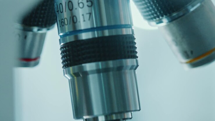 Microscope Objective Lenses Being Turned during Medical Test