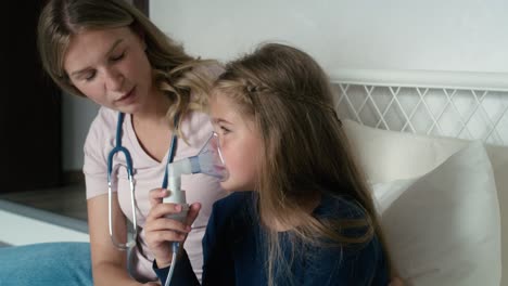 doctor giving nebulizer to an ill child at home