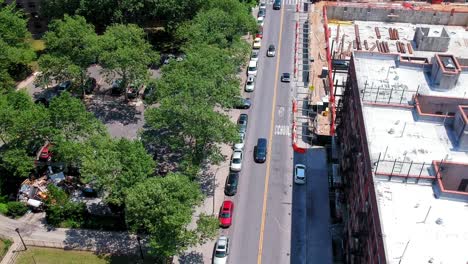 Top-down-view-of-cars-moving-through-a-street-in-Brooklyn