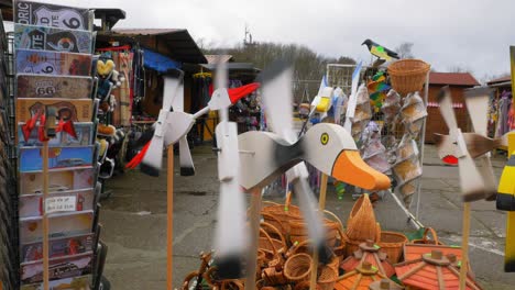 wooden bird toy windmill wings and sky