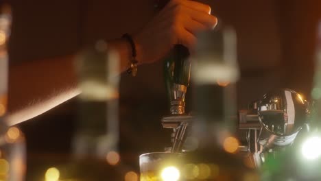 golden beer pouring smoothly from a beer dispenser into a glass at a lively bar setting