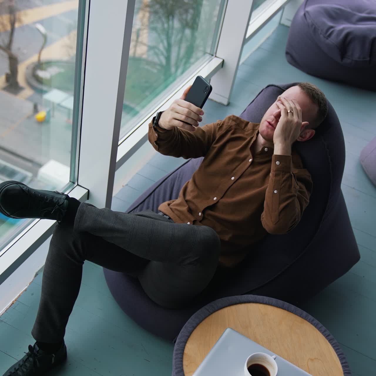 Happy businessman using mobile phone