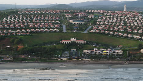 A-themed-resort-and-adventure-waterpark-in-the-beach-resort-town-of-Mui-Ne,-centara-Mirage-resort-and-Spa-aerial-zoom-out