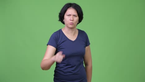 angry woman with short hair talking to camera