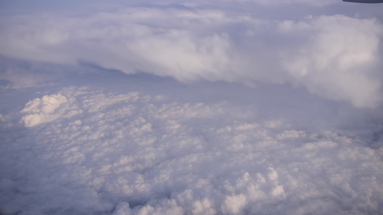 Flying above the clouds in an airplane