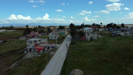 bird's eye view of rural brick houses in almoloya in the state of mexico with ample land for planting