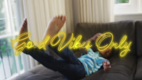 animation of good vibes only text over african american boy lying