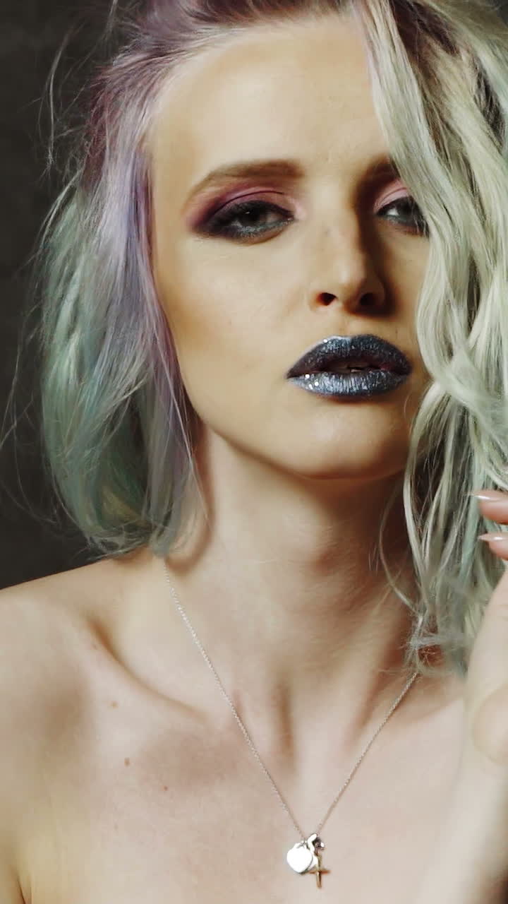 Beautiful girl with colored hair. Colored hairs. Portrait of smiling woman with color hairs. Gradient