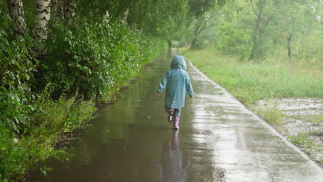 child races across puddles in park active kid revels in sensation of freedom and spontaneity