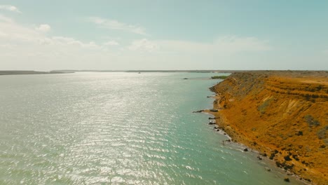 Aerial-view-flying-over-the-beach-in-the-desert,-Colombia,-la-guajira,-punta-gallinas