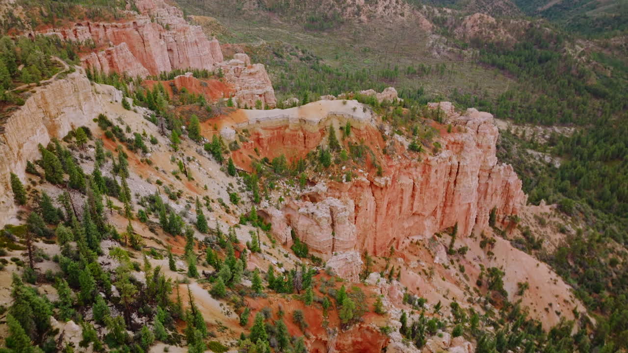 Bryce National park in Utah, USA. Superb canyons with pine trees growing on them and at the foot of the rocks. Aerial view.