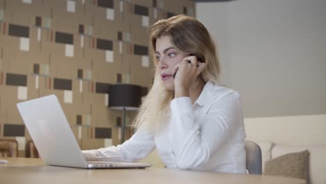 positive friendly businesswoman talking on phone