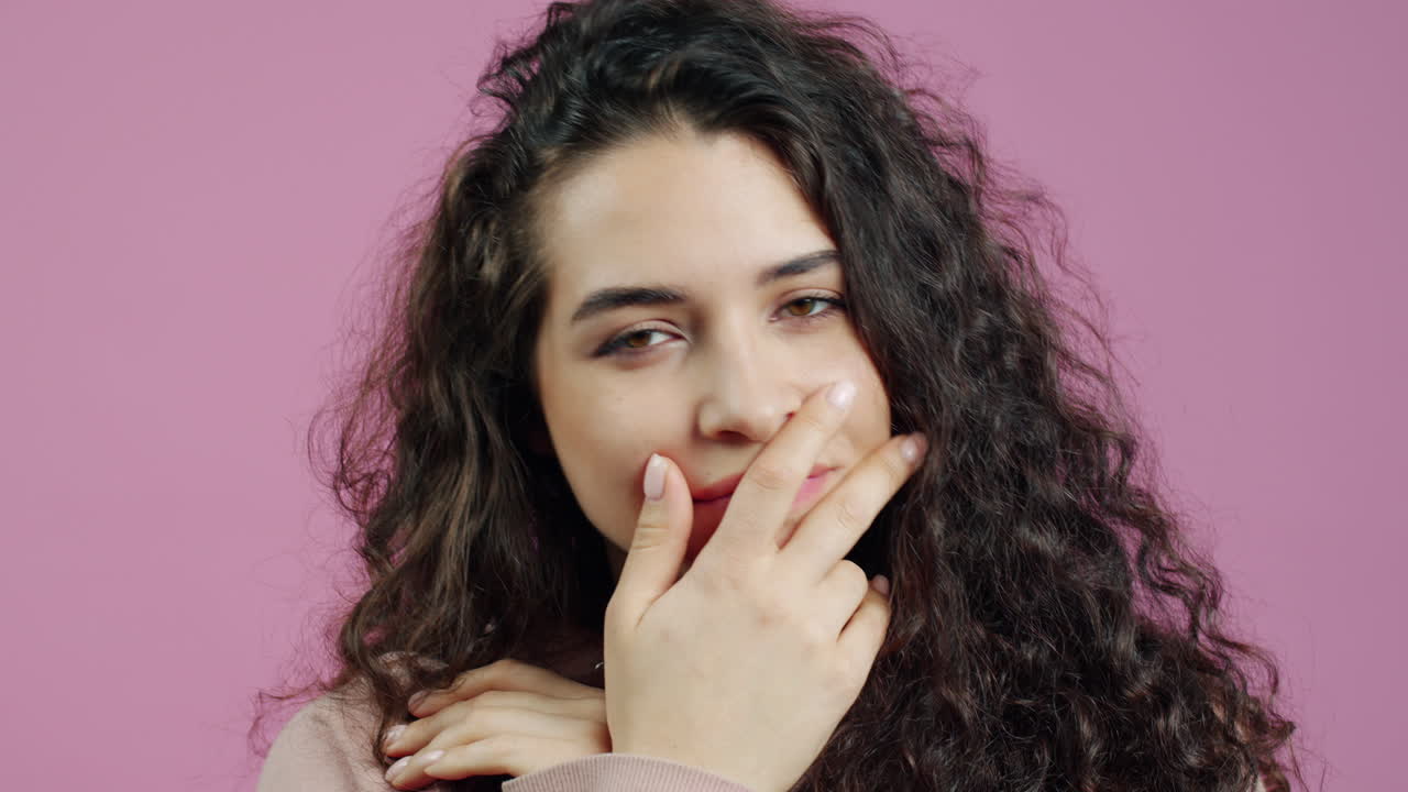 Woman with Curly Hair in a Studio Shot